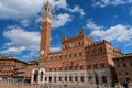 SIENA, ITALY Ã¢â¬â MAY 25, 2017: Campo Square Piazza del Campo, Palazzo Pubblico and Mangia Tower Torre del Mangia. Royalty Free Stock Photo